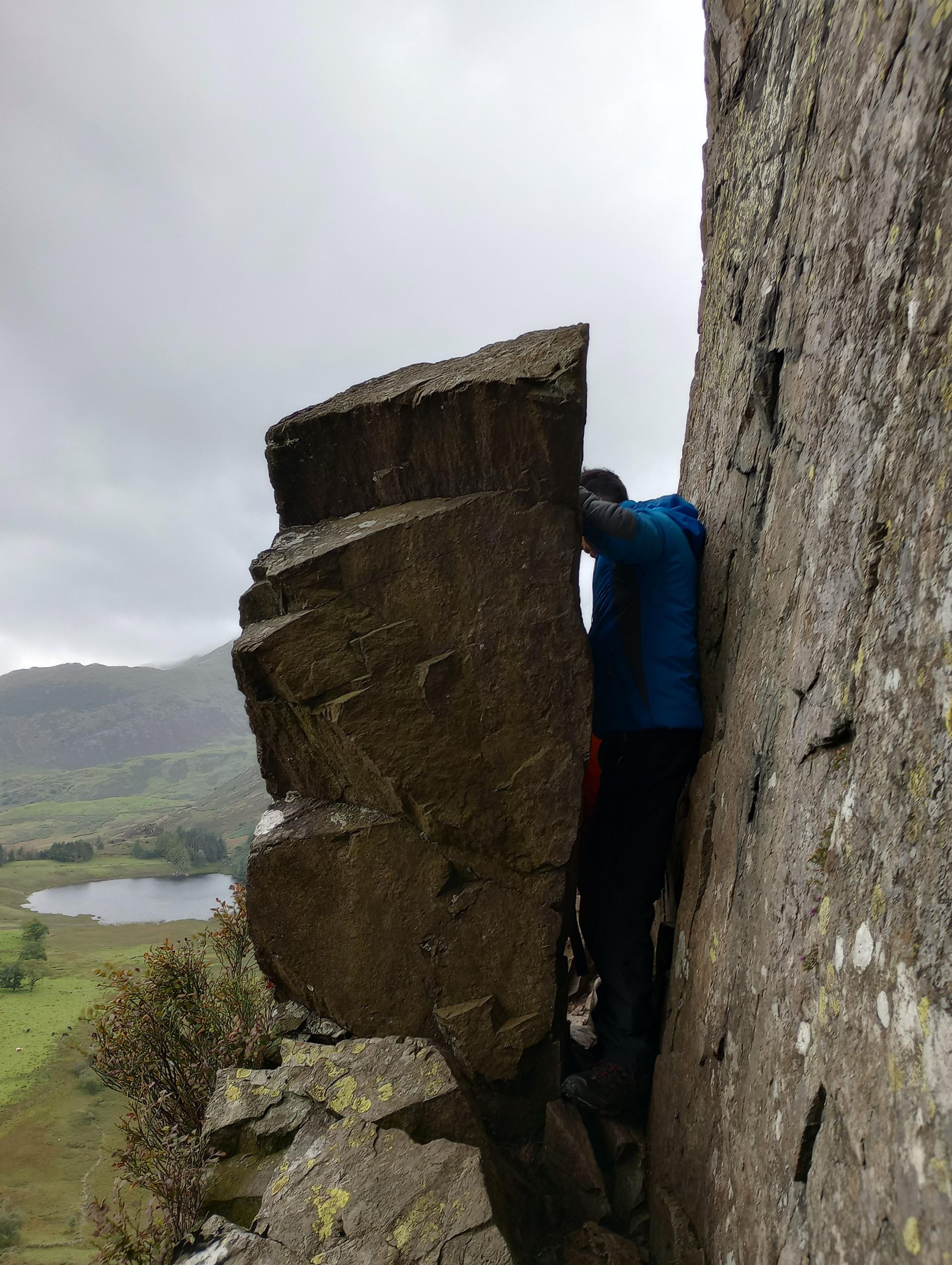 Fat Man's Agony with Blea Tarn below. Embrace the squeeze!